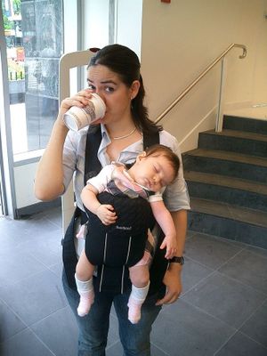 Laura Castro-Schilo with her daughter at a conference
