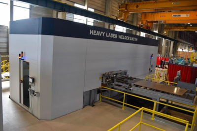 Figure 1a –  An external view of the containment of the heavy laser welder at Montbrison workshop. The size of the door gives an idea of the dimensions of this industrial welder.