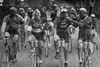 Julien Vervaecke and Maurice Geldhof are smoking during the 1927 Tour de France. Gustaaf van Slembrouck is lightning the cigarette.